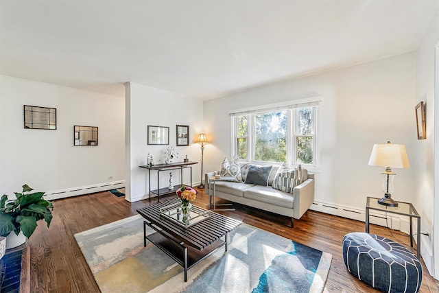 living area featuring baseboard heating, wood finished floors, and baseboards