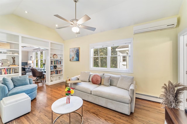 living area featuring vaulted ceiling, wood finished floors, baseboard heating, and a wall mounted AC