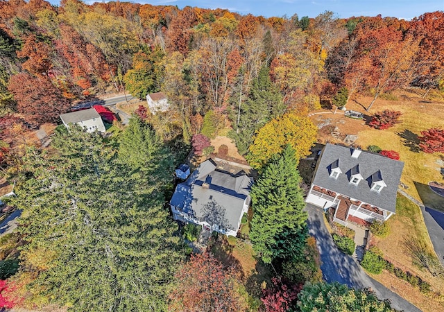 birds eye view of property with a forest view