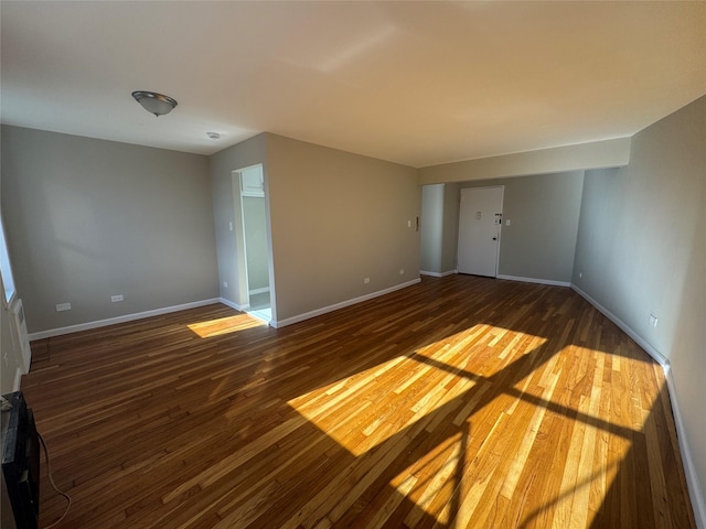 empty room featuring dark hardwood / wood-style floors