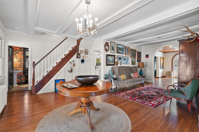 living room with an inviting chandelier, a healthy amount of sunlight, dark hardwood / wood-style flooring, crown molding, and beamed ceiling