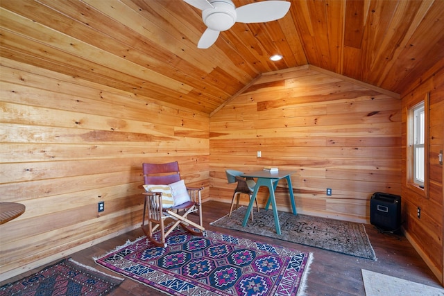 living area featuring hardwood / wood-style flooring, wooden ceiling, wood walls, and lofted ceiling