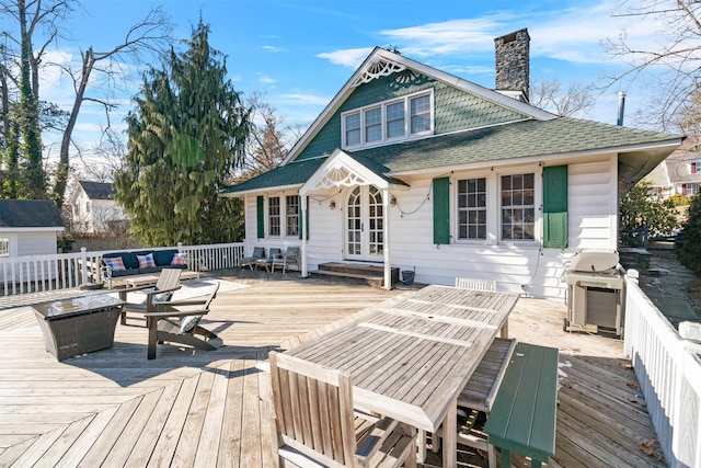 wooden deck with area for grilling