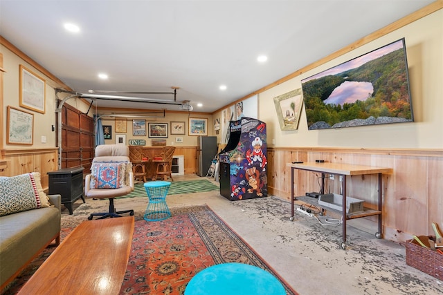 living room featuring crown molding and wooden walls