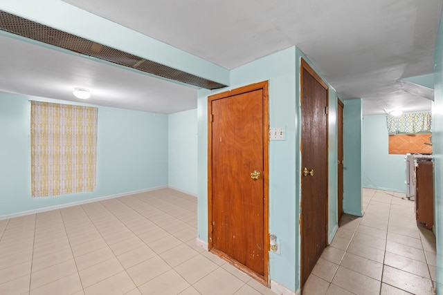 hallway with light tile patterned flooring