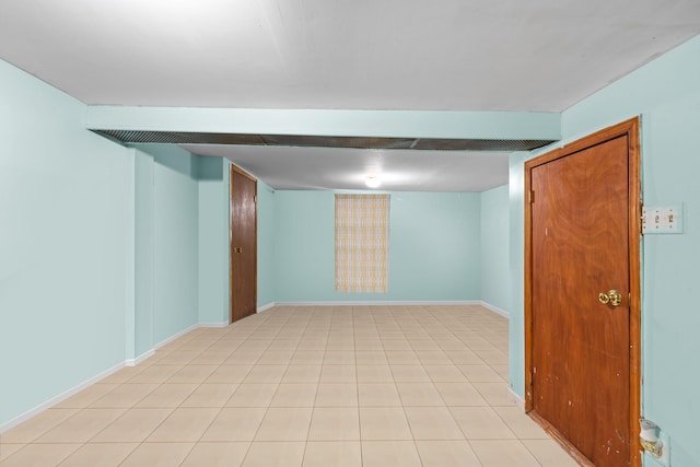 basement featuring light tile patterned floors