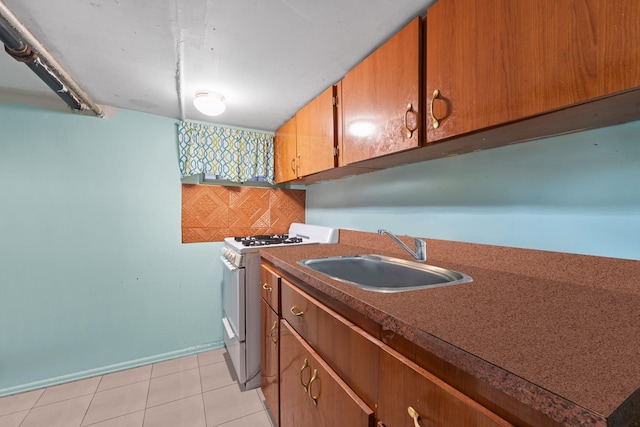 laundry room with sink and light tile patterned floors