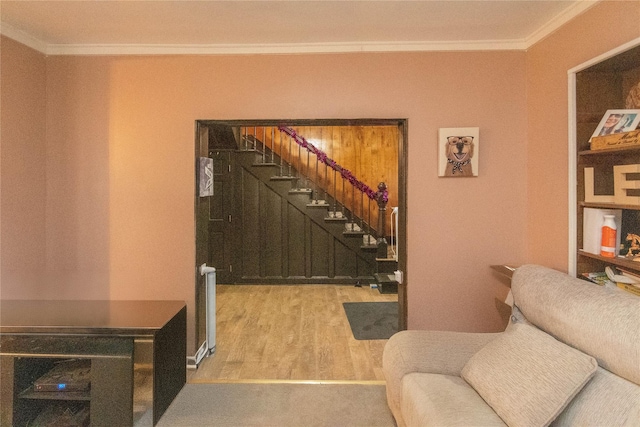 sitting room featuring crown molding, hardwood / wood-style floors, and radiator heating unit