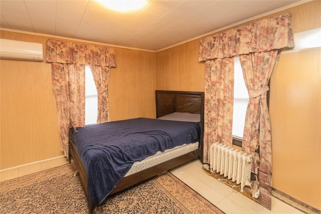 bedroom with a wall unit AC, crown molding, and radiator heating unit