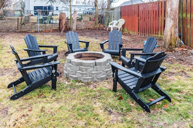 view of yard featuring an outdoor fire pit