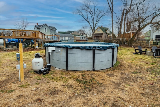 view of yard with a swimming pool side deck