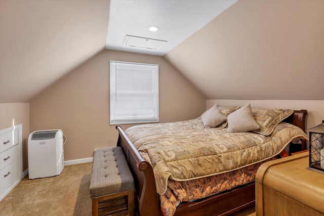 carpeted bedroom with vaulted ceiling