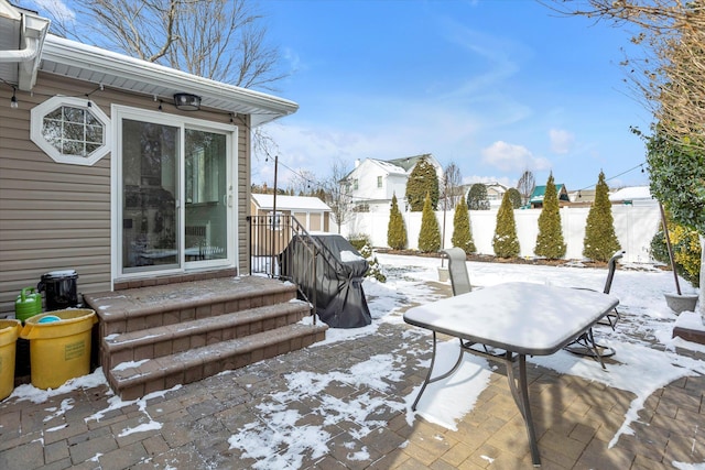 view of snow covered patio