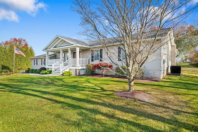 greek revival inspired property featuring cooling unit, a porch, and a front lawn