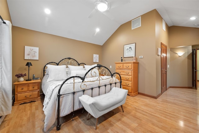 bedroom with ceiling fan, light wood-type flooring, and vaulted ceiling