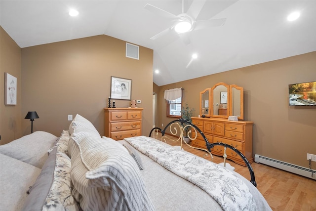 bedroom featuring ceiling fan, a baseboard heating unit, light hardwood / wood-style flooring, and vaulted ceiling