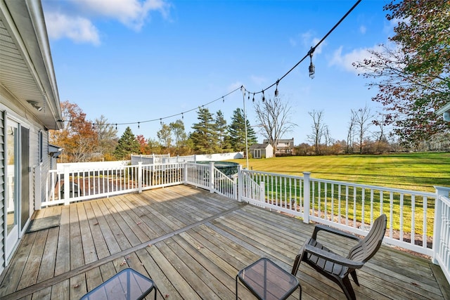 deck featuring a lawn