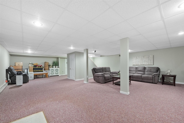 living room featuring carpet floors and a paneled ceiling