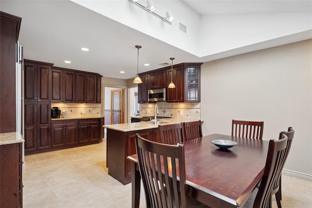 dining space with light tile patterned floors