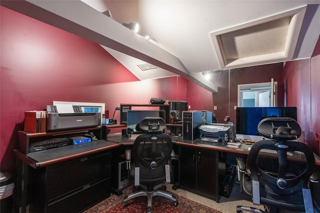 office area with carpet floors and vaulted ceiling