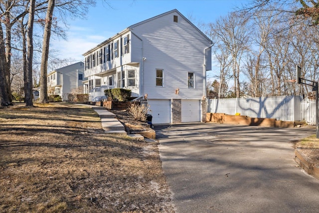 view of property exterior featuring a garage