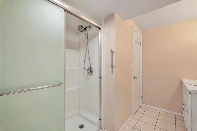 bathroom featuring tile patterned floors, vanity, and an enclosed shower