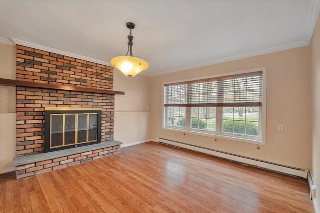 unfurnished living room featuring baseboard heating, a brick fireplace, crown molding, and wood-type flooring