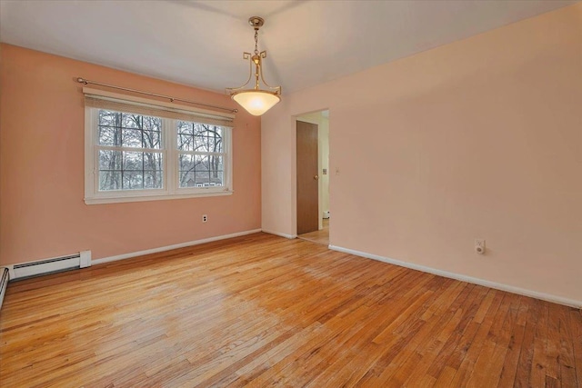 spare room featuring light wood-type flooring