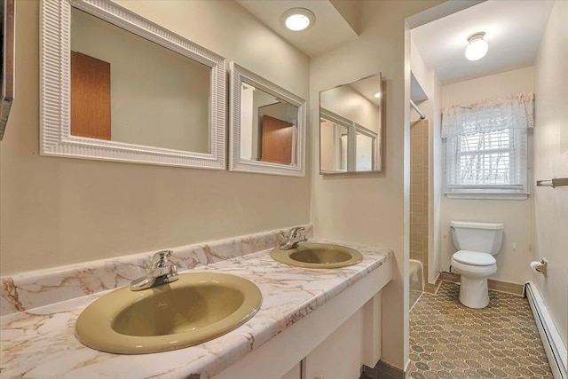 full bathroom with baseboard heating, shower / tub combination, toilet, and vanity