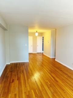 spare room with wood-type flooring