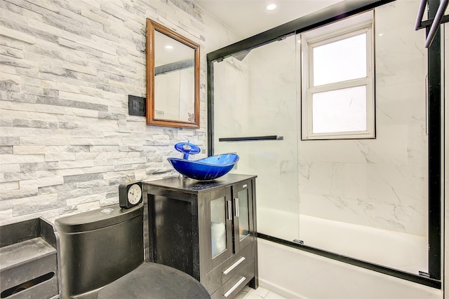 full bathroom with shower / bath combination with glass door, vanity, and toilet