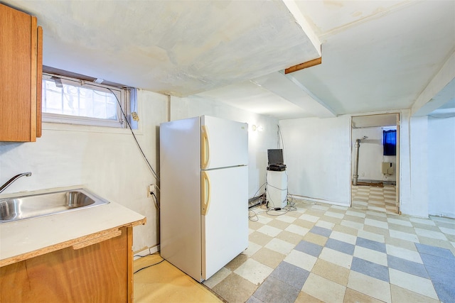 kitchen with white fridge and sink