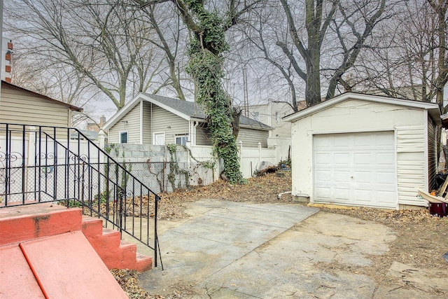 exterior space featuring an outbuilding and a garage