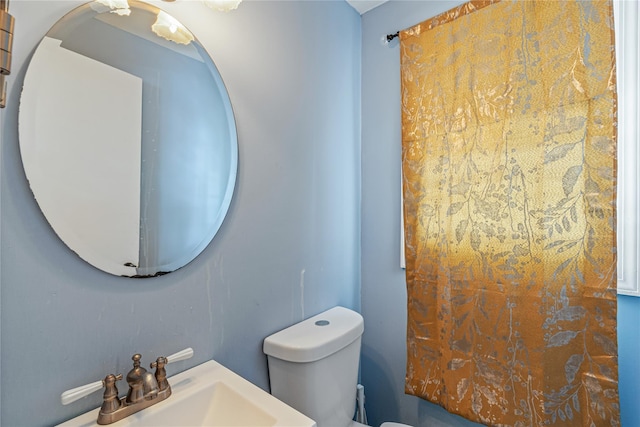 bathroom featuring sink and toilet