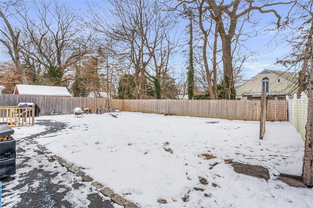 view of yard layered in snow