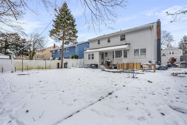 view of snow covered house