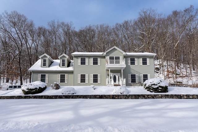 view of front of house with a balcony