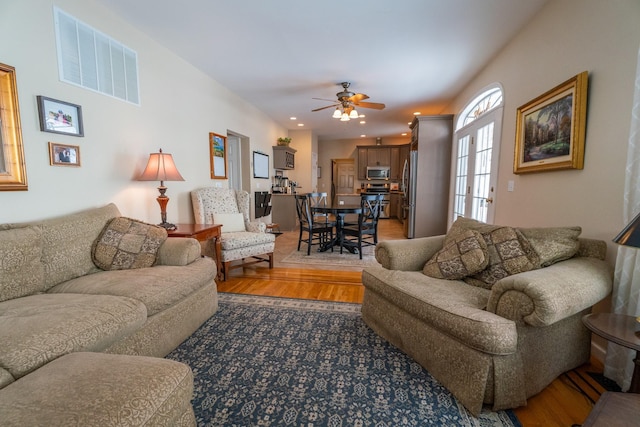 living room featuring a ceiling fan, recessed lighting, light wood-style floors, and visible vents