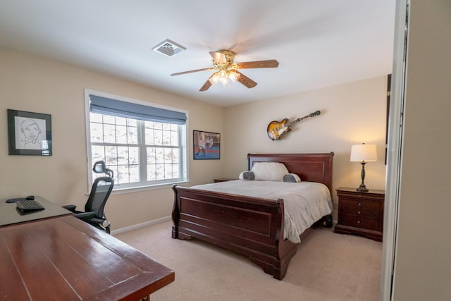 bedroom featuring baseboards, a ceiling fan, visible vents, and light carpet