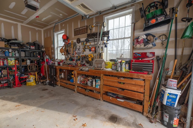 garage featuring a workshop area and a garage door opener