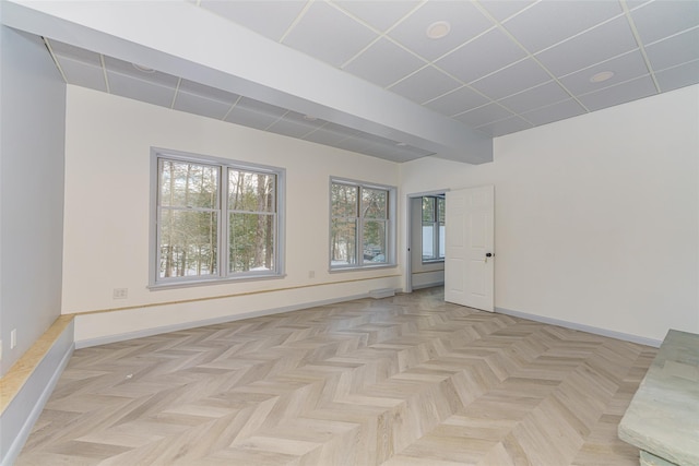 unfurnished room with light parquet flooring