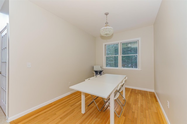 dining space featuring light wood-type flooring