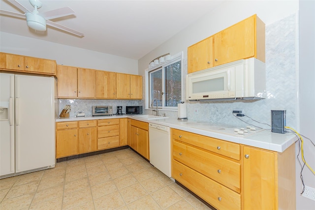 kitchen with ceiling fan, decorative backsplash, sink, and white appliances