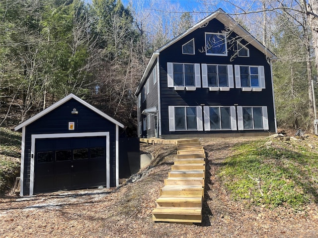 105 Mcnamee Rd, Canaan, NY 12029 - view of front of home with an outdoor structure, a detached garage, and stairs