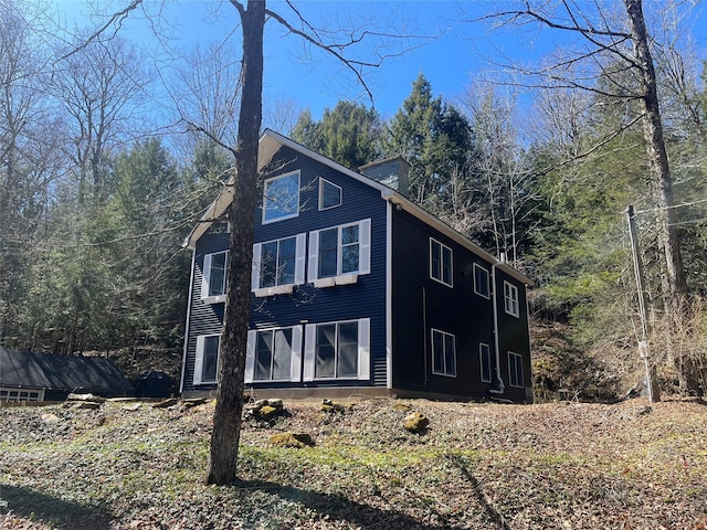 105 Mcnamee Rd, Canaan, NY 12029 - view of front of property with a chimney and a view of trees