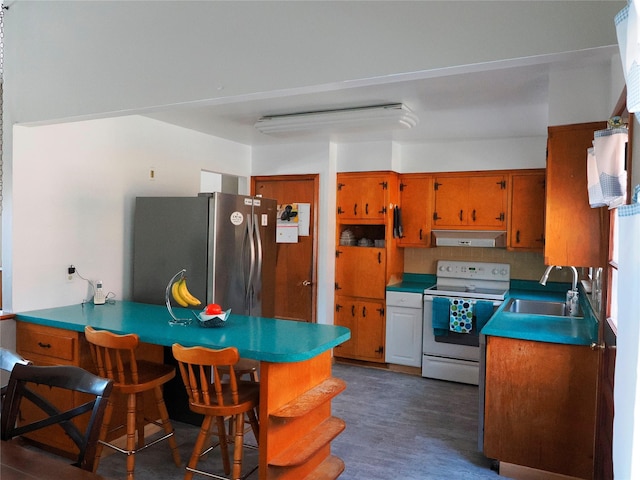 kitchen featuring brown cabinets, white range with electric stovetop, a sink, freestanding refrigerator, and under cabinet range hood