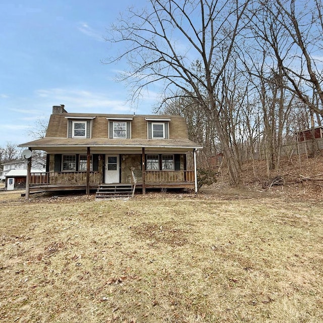 view of front of home featuring a porch and a front yard