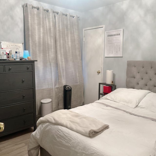 bedroom featuring light wood-type flooring