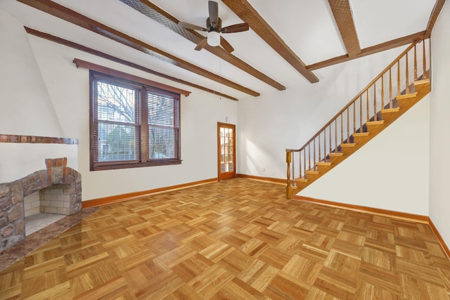 unfurnished living room with beamed ceiling, light parquet floors, and ceiling fan