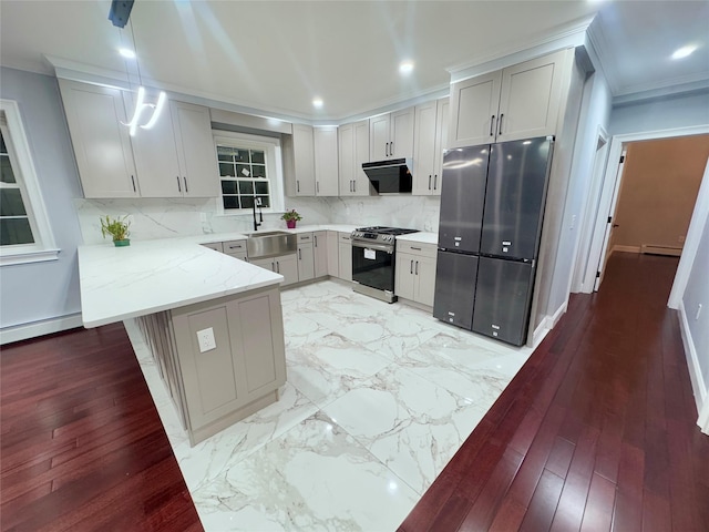 kitchen featuring refrigerator, kitchen peninsula, decorative backsplash, stainless steel range with gas cooktop, and light stone counters